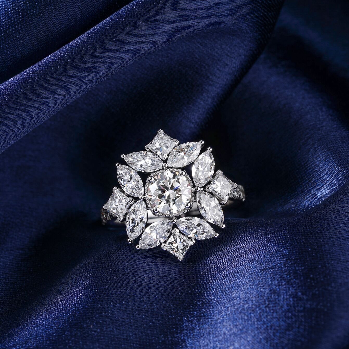 Diamond flower ring on navy fabric